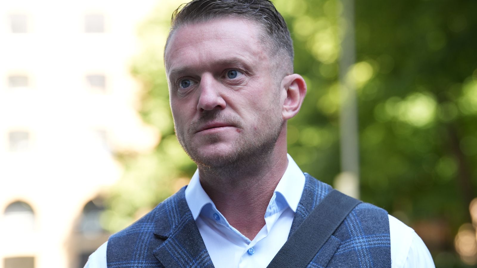 Police investigate assault as video appears to show Tommy Robinson at station | UK News